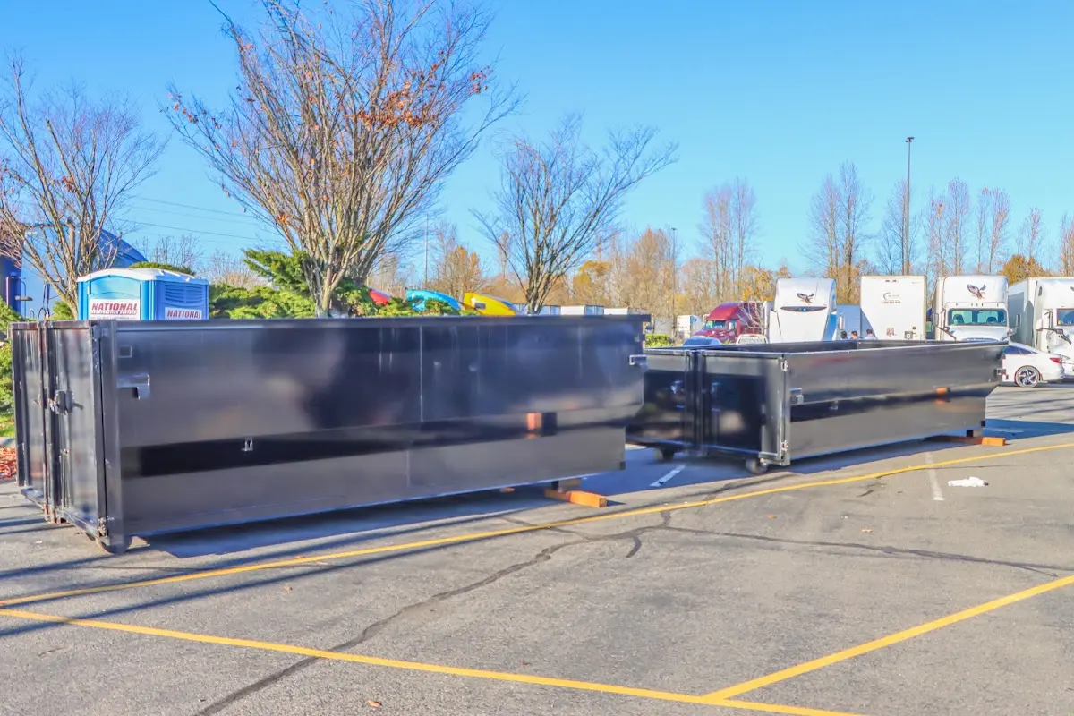 Professional dumpster rental service with roll-off container on residential driveway in La Grange Park